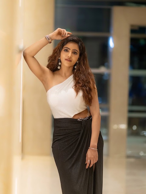 Athulyaa Ravi in white one-shoulder bodysuit and black maxi skirt