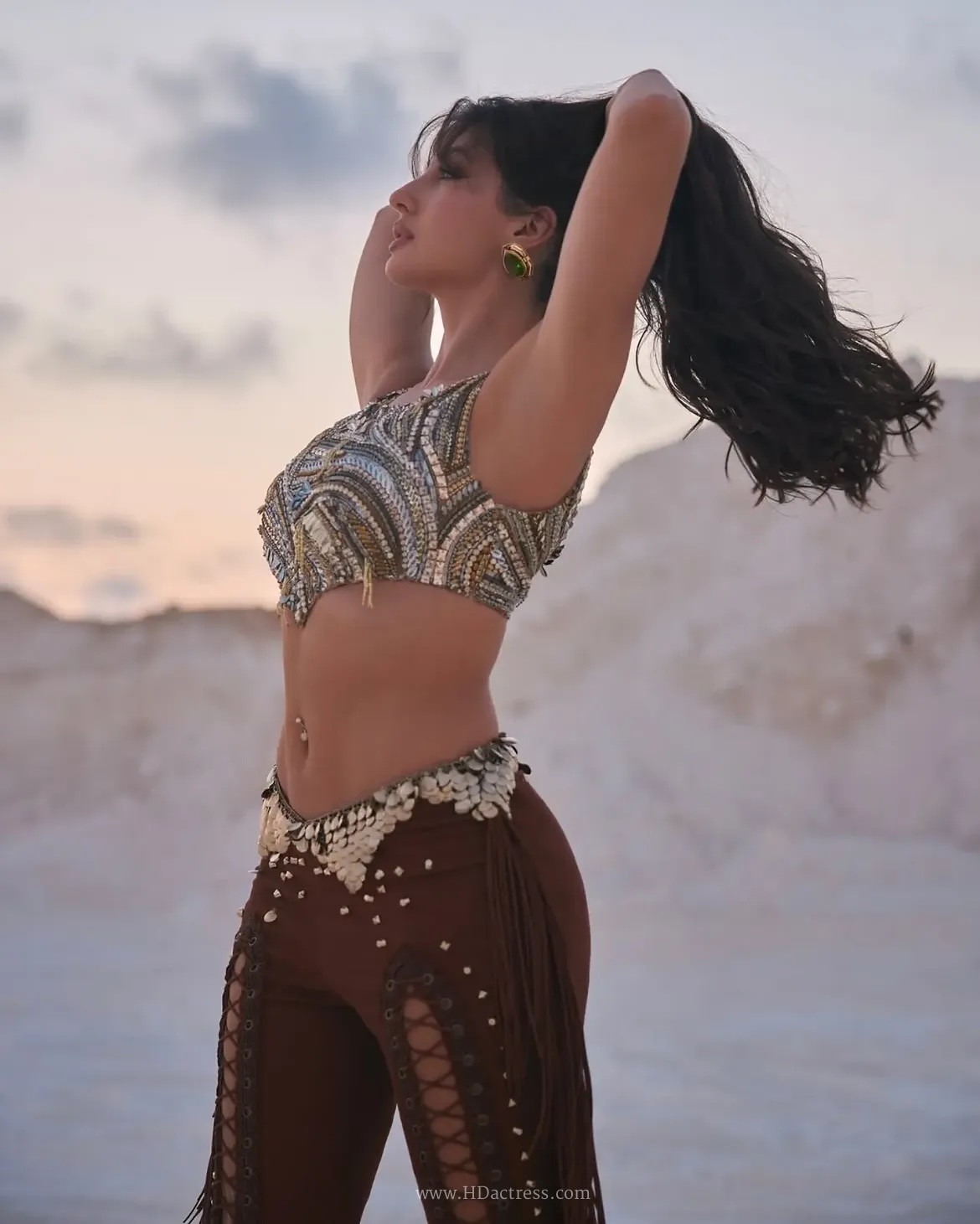 Nora Fatehi two piece outfit, Nora Fatehi navel outfit photos, Nora Fatehi crop top styling, Bollywood fashion trends, designer two piece sets, red carpet fashion gallery, celebrity style breakdown
