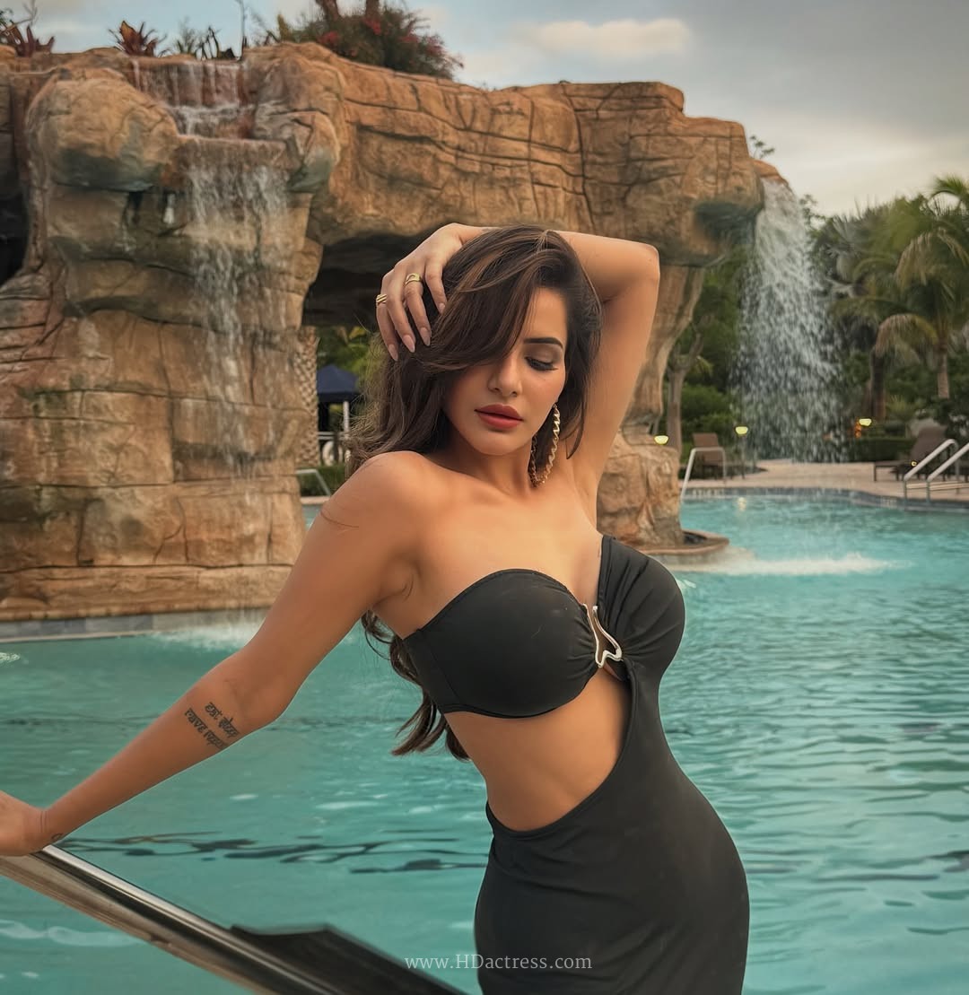 Ashu Reddy Stuns in Latest Photoshoot Wearing a Chic Black Strapless Waist-Cutout Midi