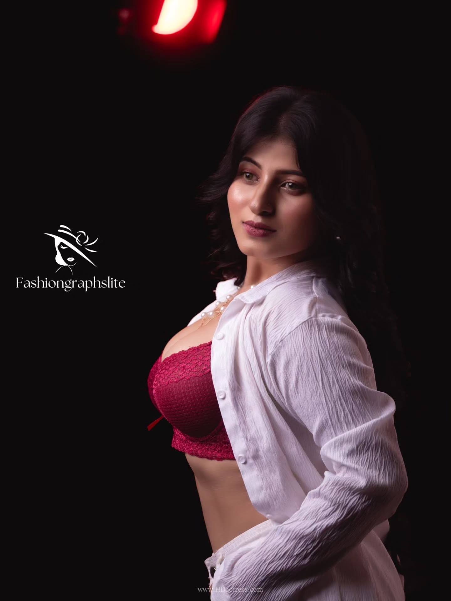Aditi Roy Chowdhury wearing red top with white shirt and cargo pants