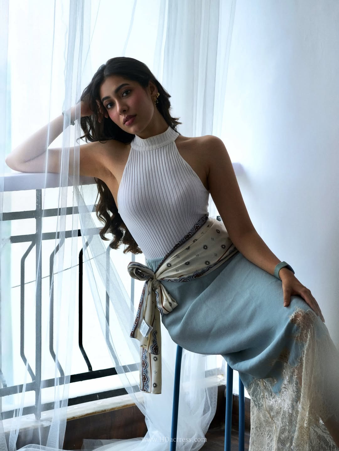 Amme Triveddi wearing white ribbed halter top with dusty blue skirt