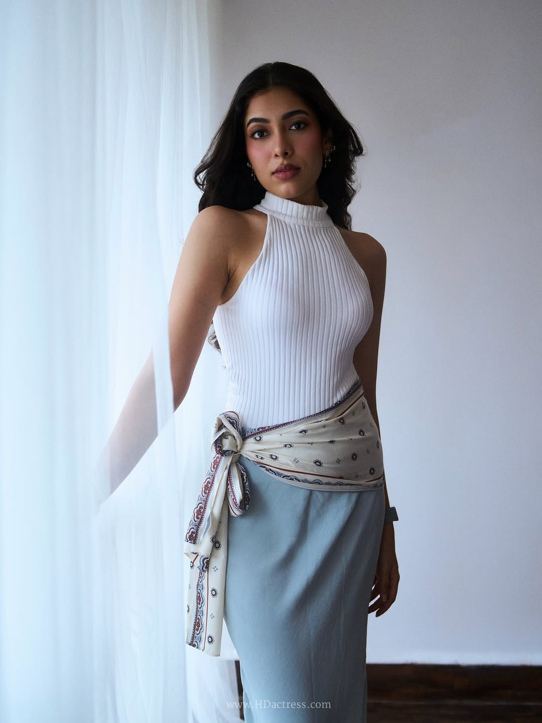 Amme Triveddi wearing white ribbed halter top with dusty blue skirt