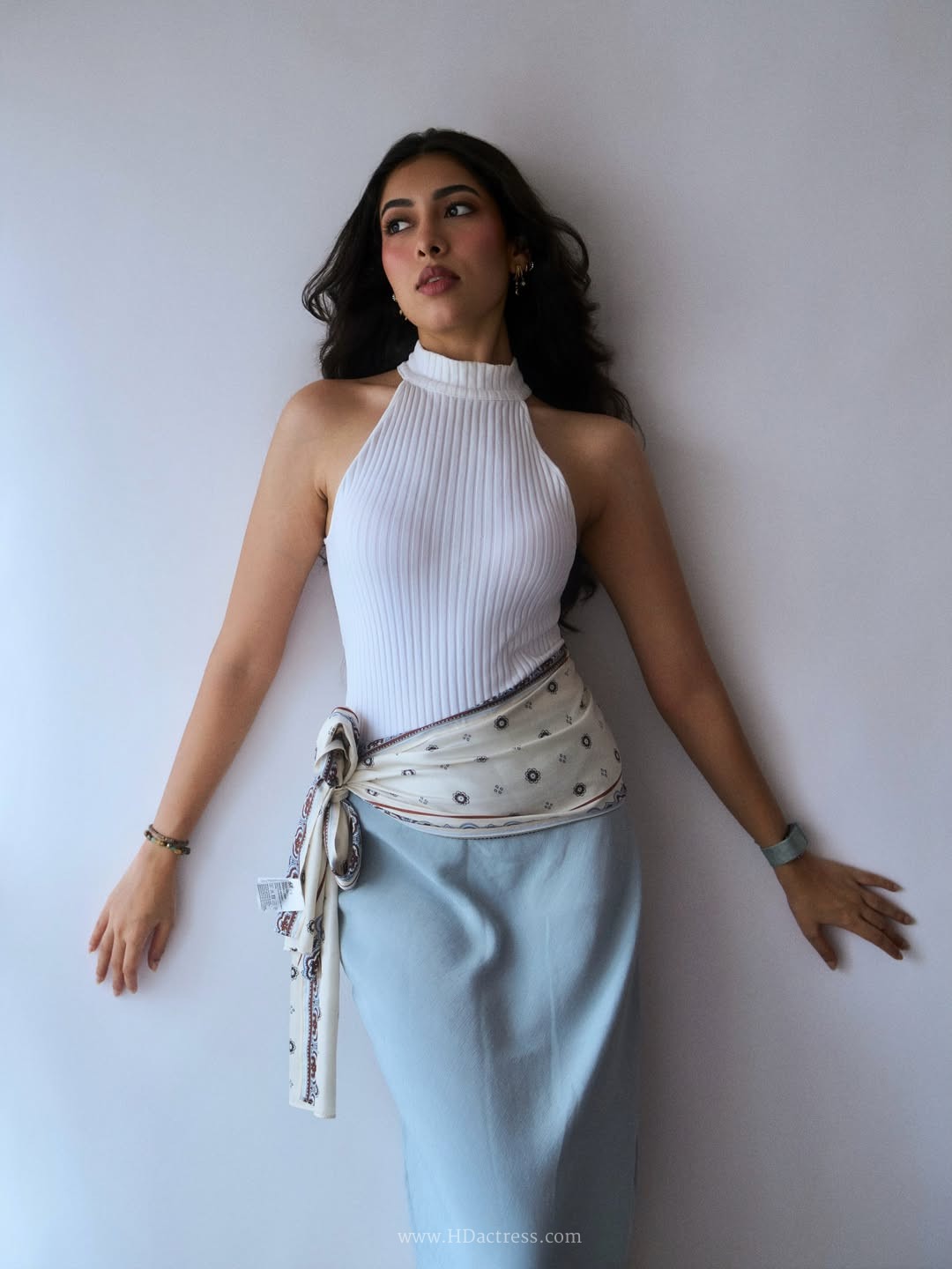 Amme Triveddi wearing white ribbed halter top with dusty blue skirt