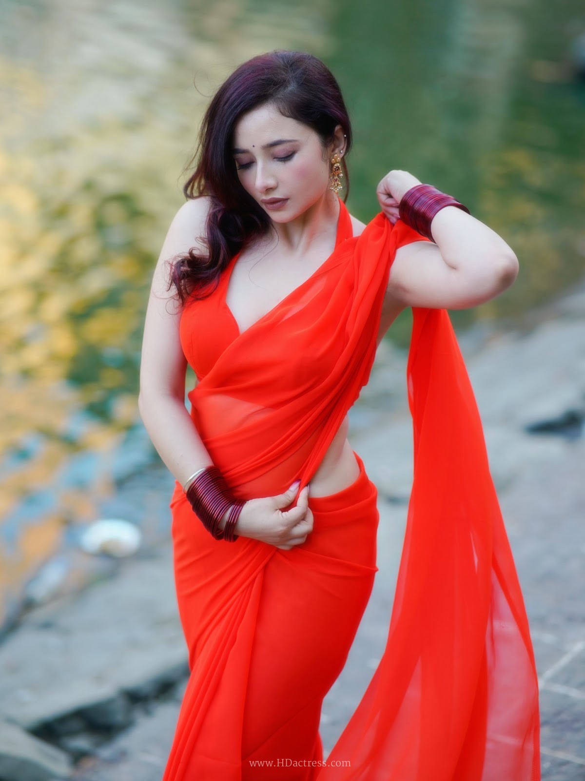 Amrita Mishra wearing vibrant orange georgette saree with matching blouse Amrita Mishra wearing vibrant orange georgette saree with matching blouse
