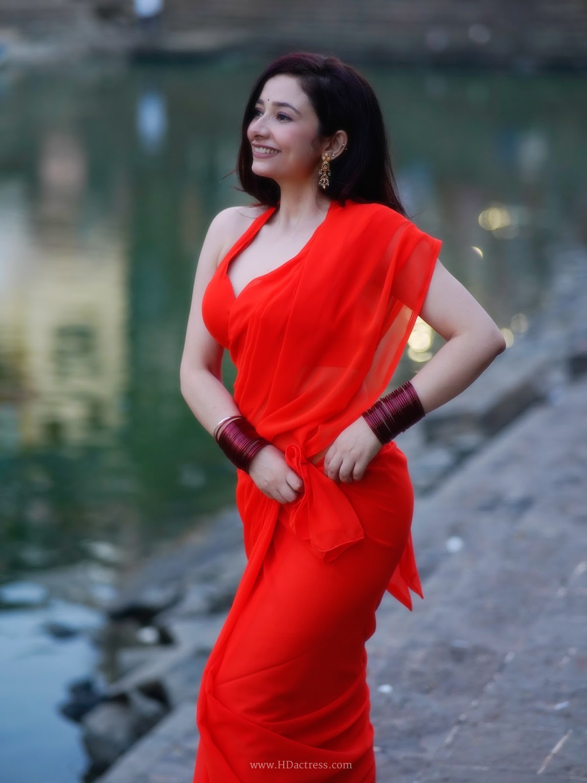 Amrita Mishra wearing vibrant orange georgette saree with matching blouse Amrita Mishra wearing vibrant orange georgette saree with matching blouse