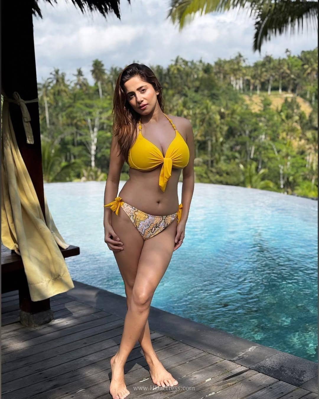 Kate Sharma wearing yellow resort wear with matching printed bottoms