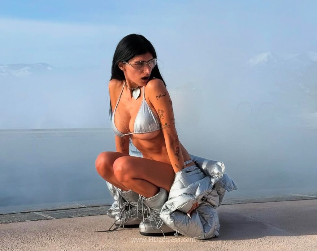 adult film star Mia Khalifa, Mia Khalifa photos, silver bikini, metallic swimwear, Mia Khalifa style, viral photoshoot, beach fashion, glamour photography, Mia Khalifa updates
