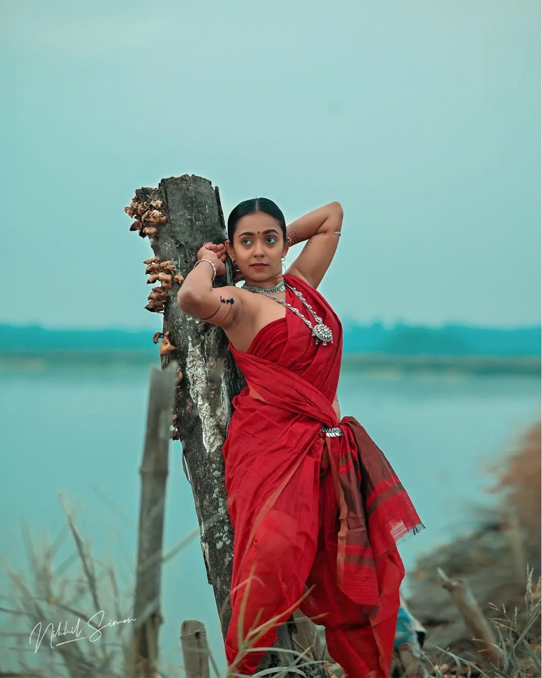 Adithi Chinnu wearing rust red and maroon draped saree Adithi Chinnu wearing rust red and maroon draped saree