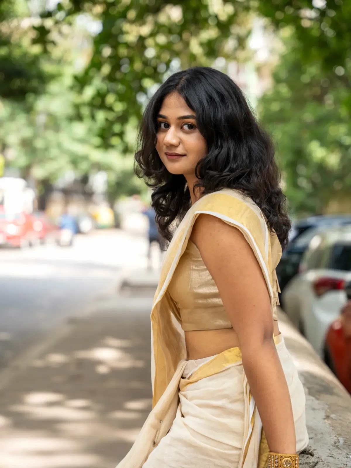 Meenal Blooms wearing Kerala Kasavu saree with golden blouse