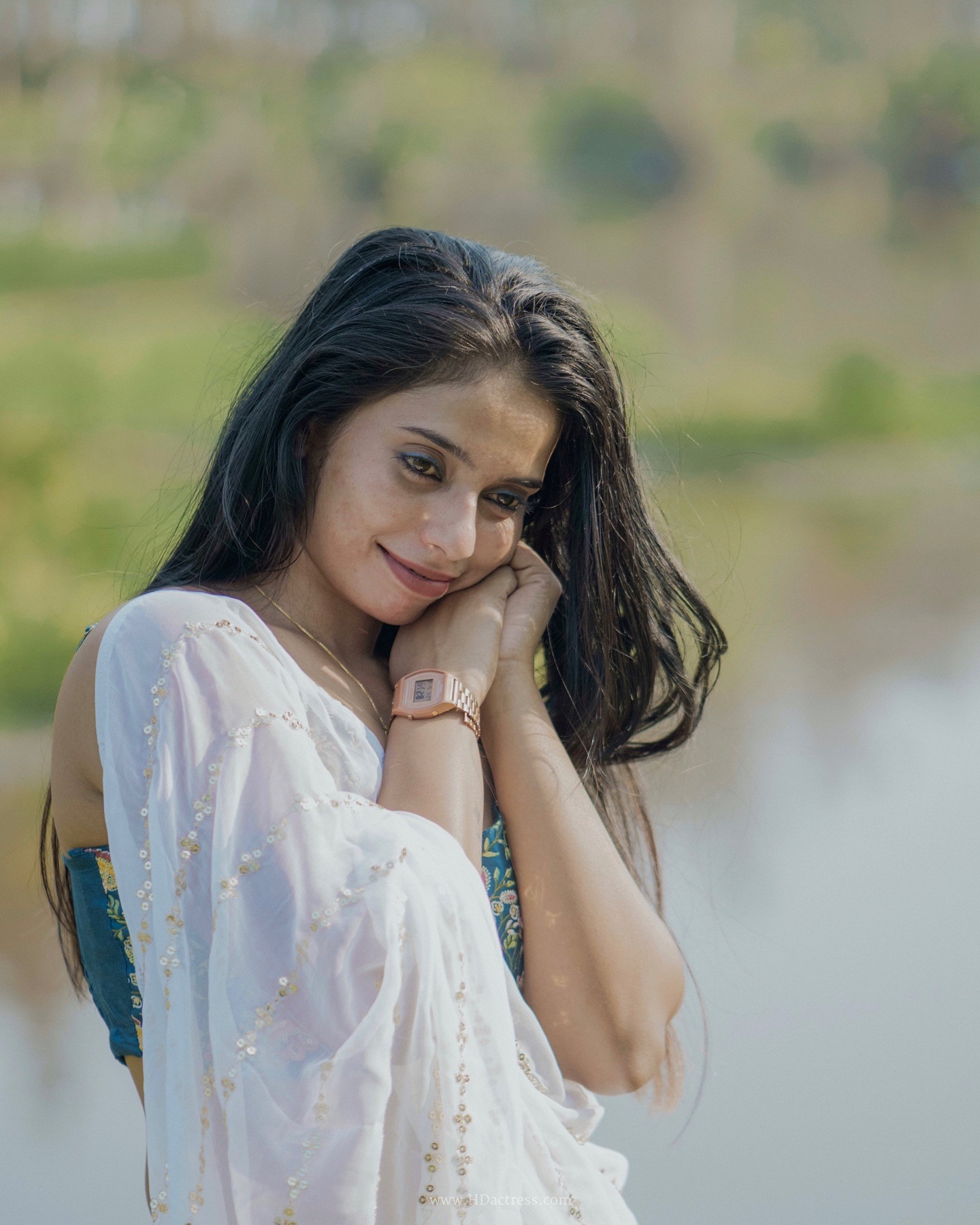 Meenu Lal S wearing white saree with gold sequin stripes Meenu Lal S wearing white saree with gold sequin stripes