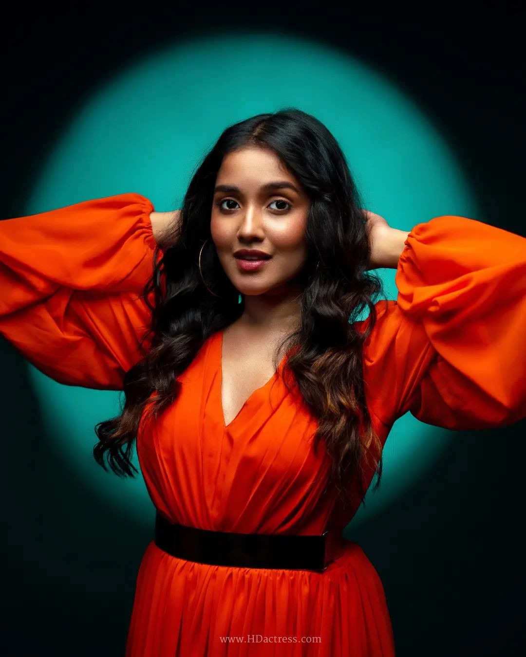 Anikha Surendran wearing vibrant orange maxi gown with billowy sleeves Anikha Surendran wearing vibrant orange maxi gown with billowy sleeves