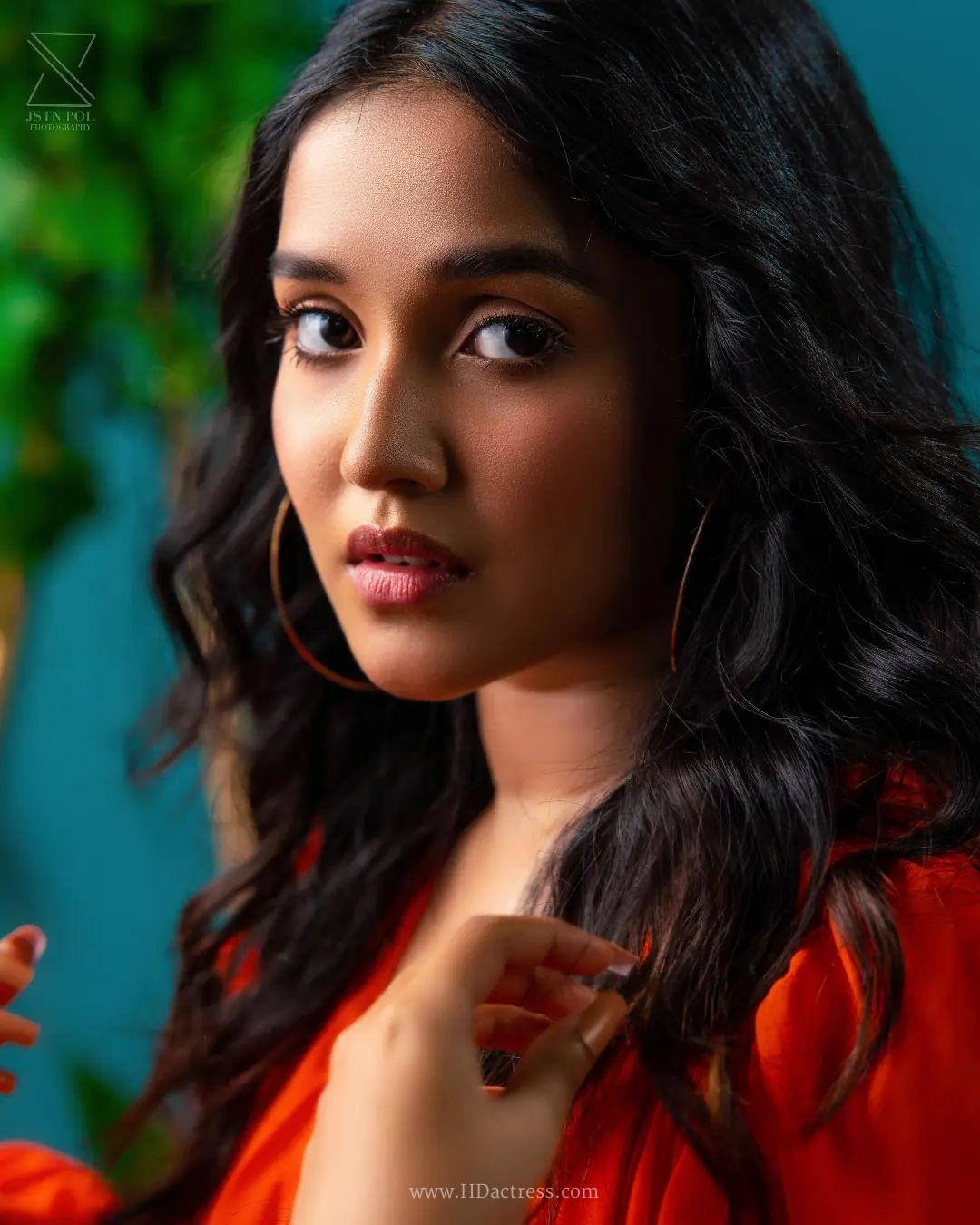 Anikha Surendran wearing vibrant orange maxi gown with billowy sleeves Anikha Surendran wearing vibrant orange maxi gown with billowy sleeves