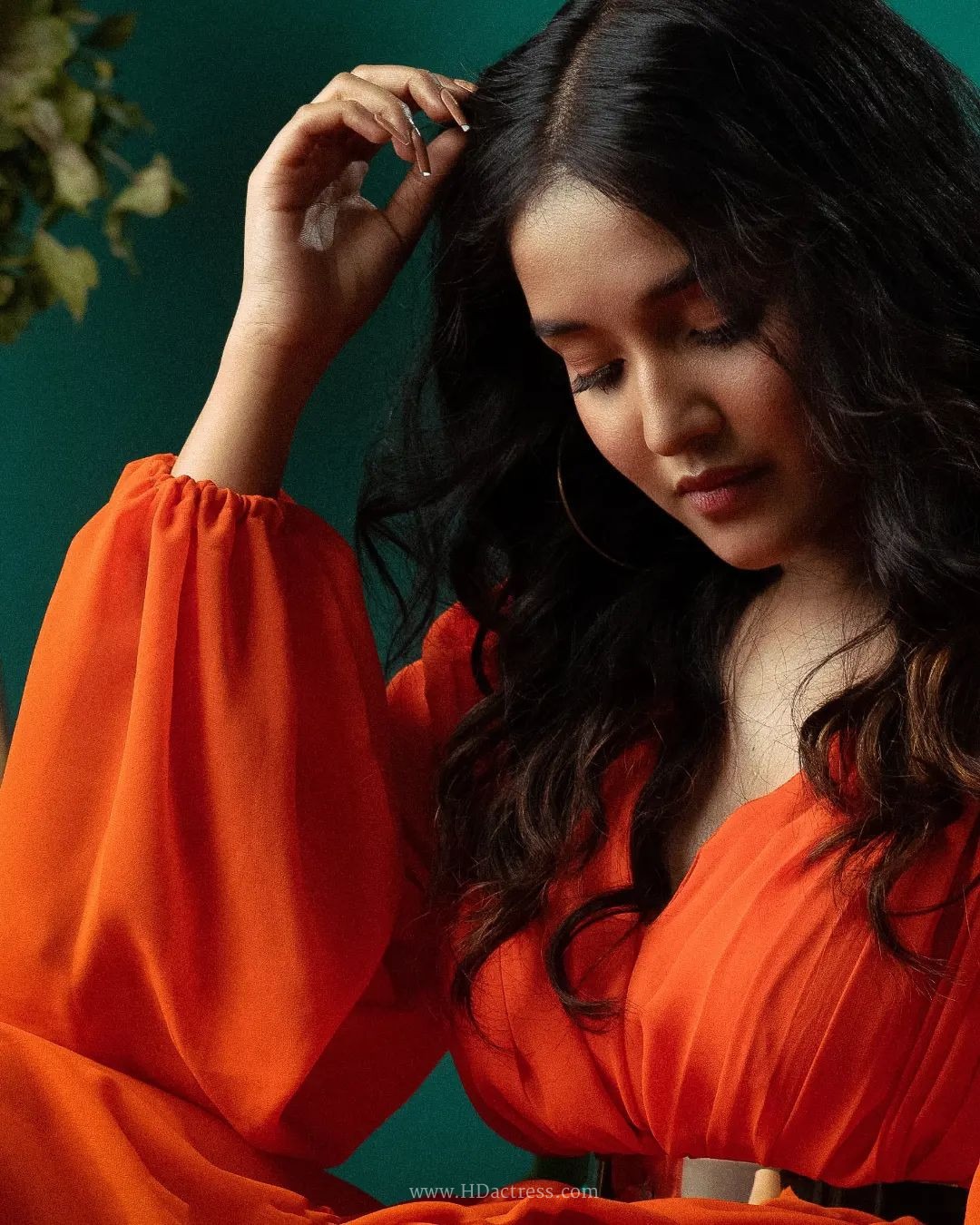 Anikha Surendran wearing vibrant orange maxi gown with billowy sleeves Anikha Surendran wearing vibrant orange maxi gown with billowy sleeves