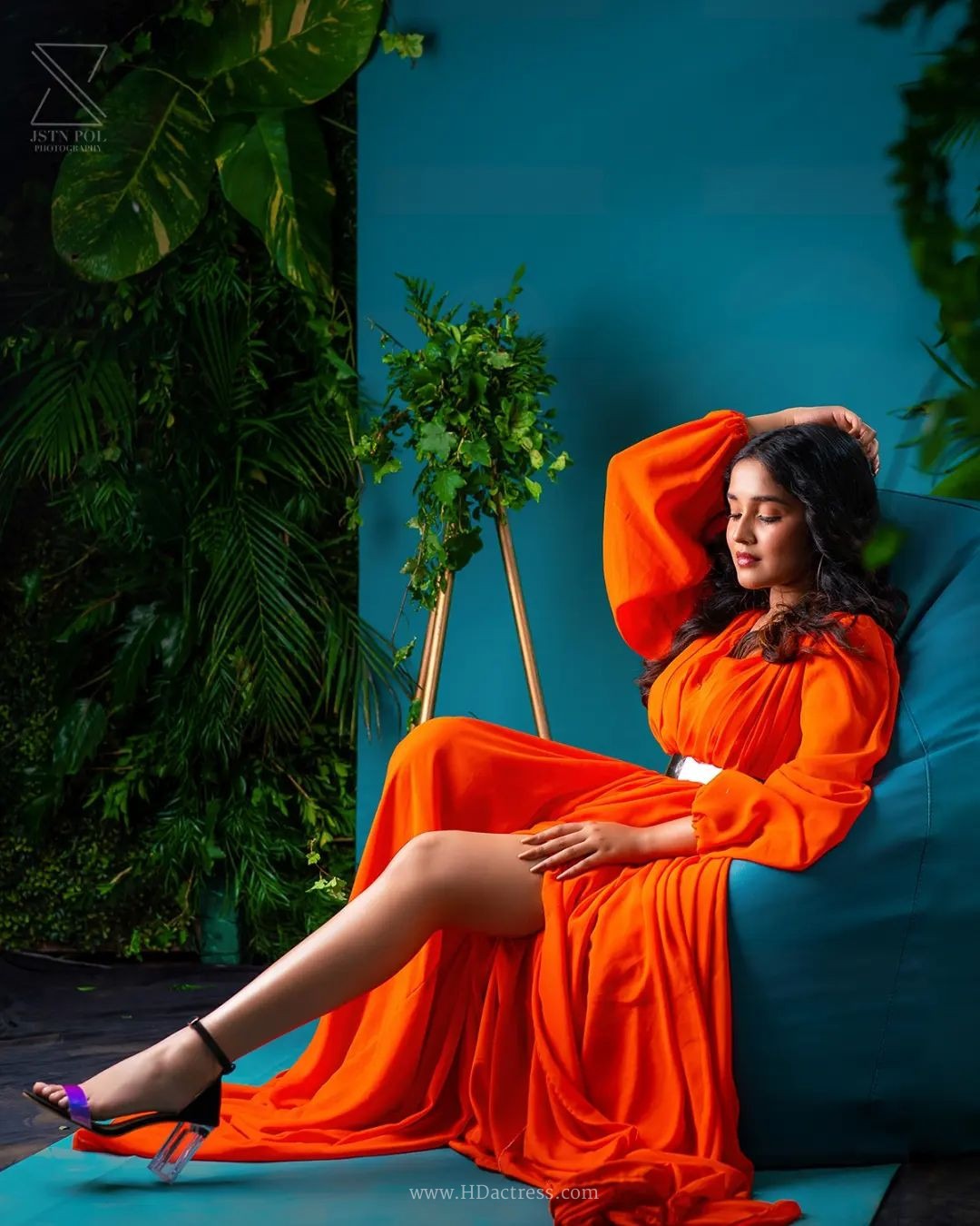 Anikha Surendran wearing vibrant orange maxi gown with billowy sleeves Anikha Surendran wearing vibrant orange maxi gown with billowy sleeves