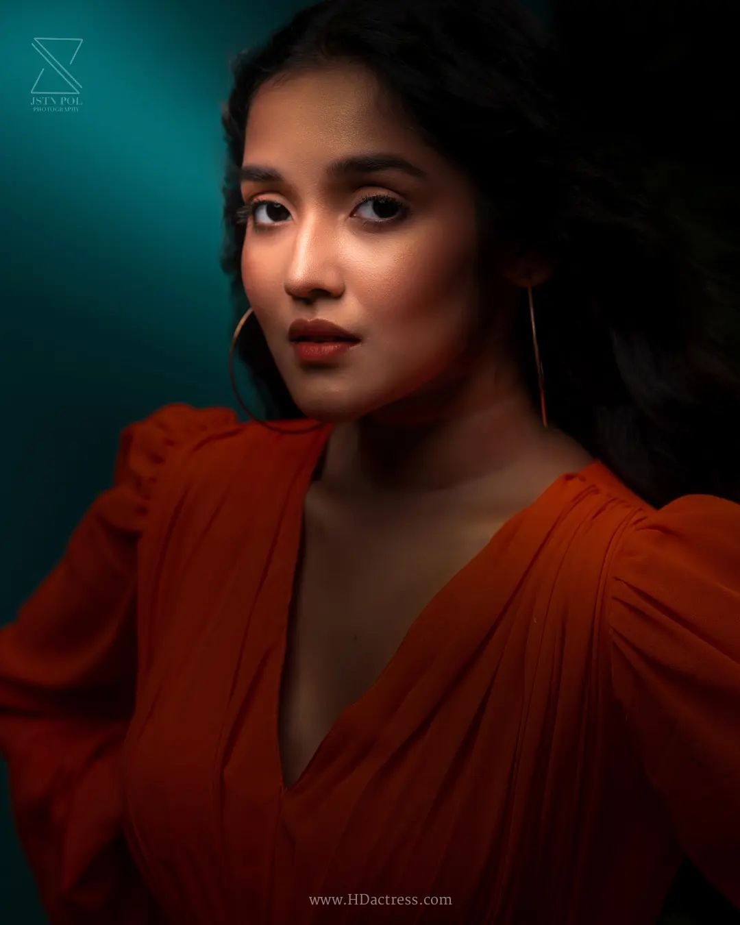 Anikha Surendran wearing vibrant orange maxi gown with billowy sleeves Anikha Surendran wearing vibrant orange maxi gown with billowy sleeves