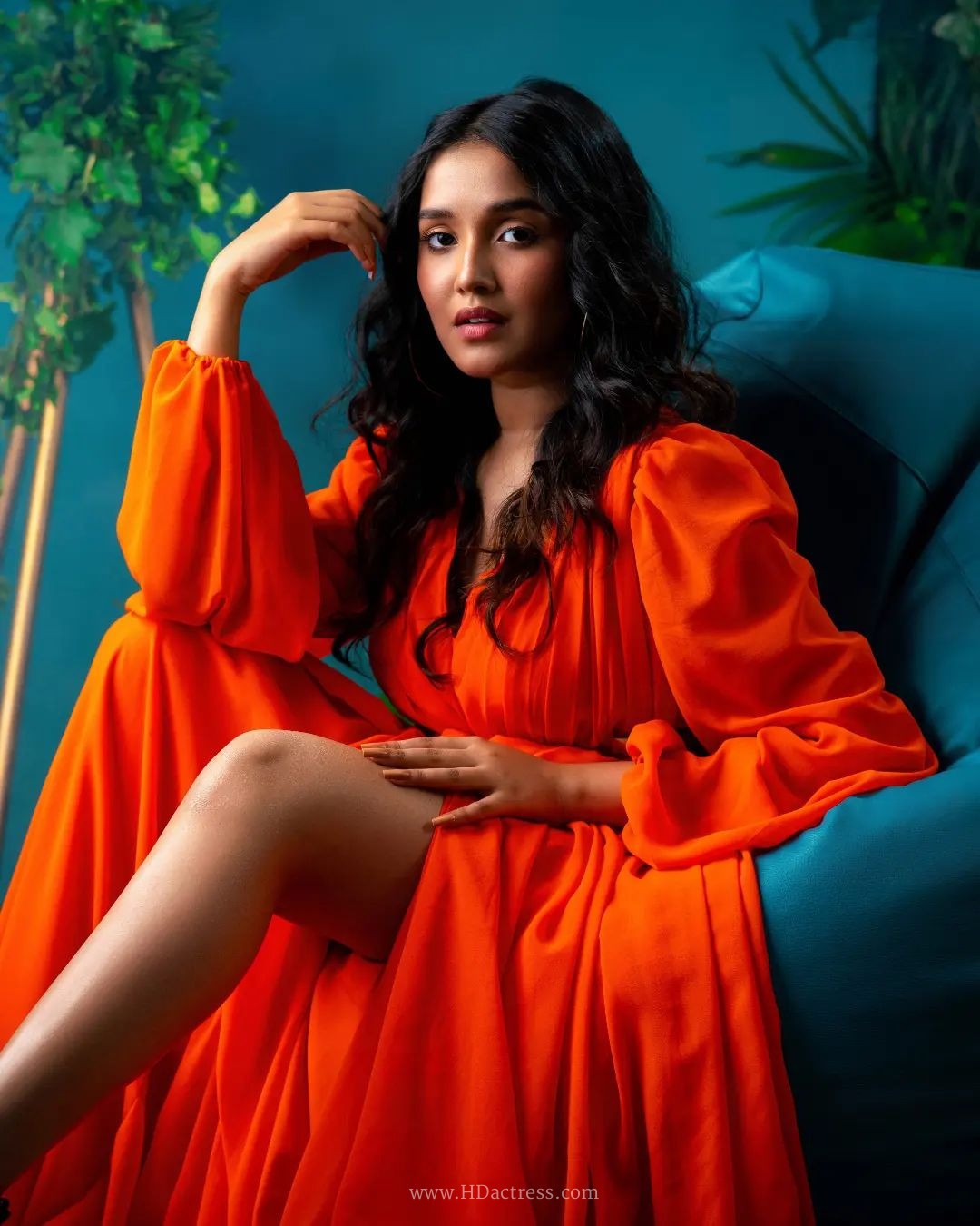 Anikha Surendran wearing vibrant orange maxi gown with billowy sleeves Anikha Surendran wearing vibrant orange maxi gown with billowy sleeves