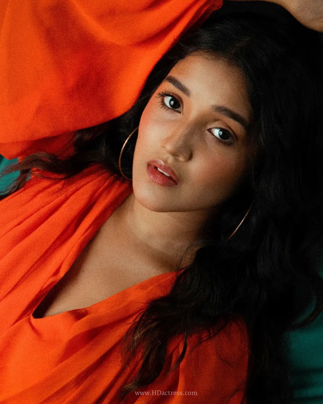 Anikha Surendran wearing vibrant orange maxi gown with billowy sleeves Anikha Surendran wearing vibrant orange maxi gown with billowy sleeves