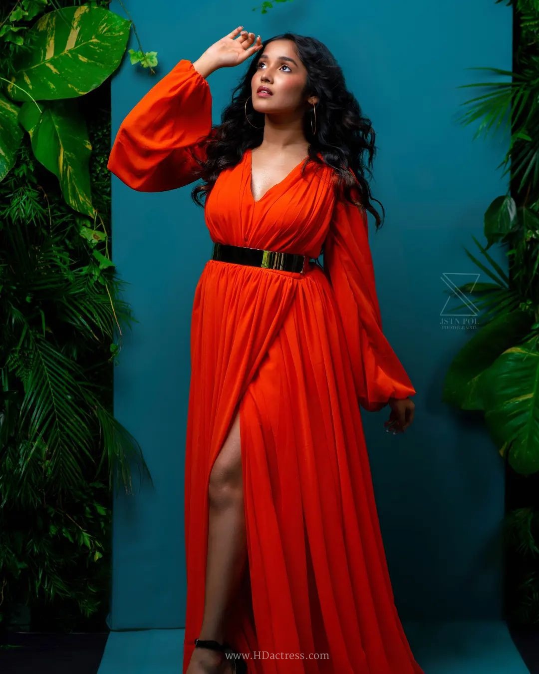 Anikha Surendran wearing vibrant orange maxi gown with billowy sleeves Anikha Surendran wearing vibrant orange maxi gown with billowy sleeves