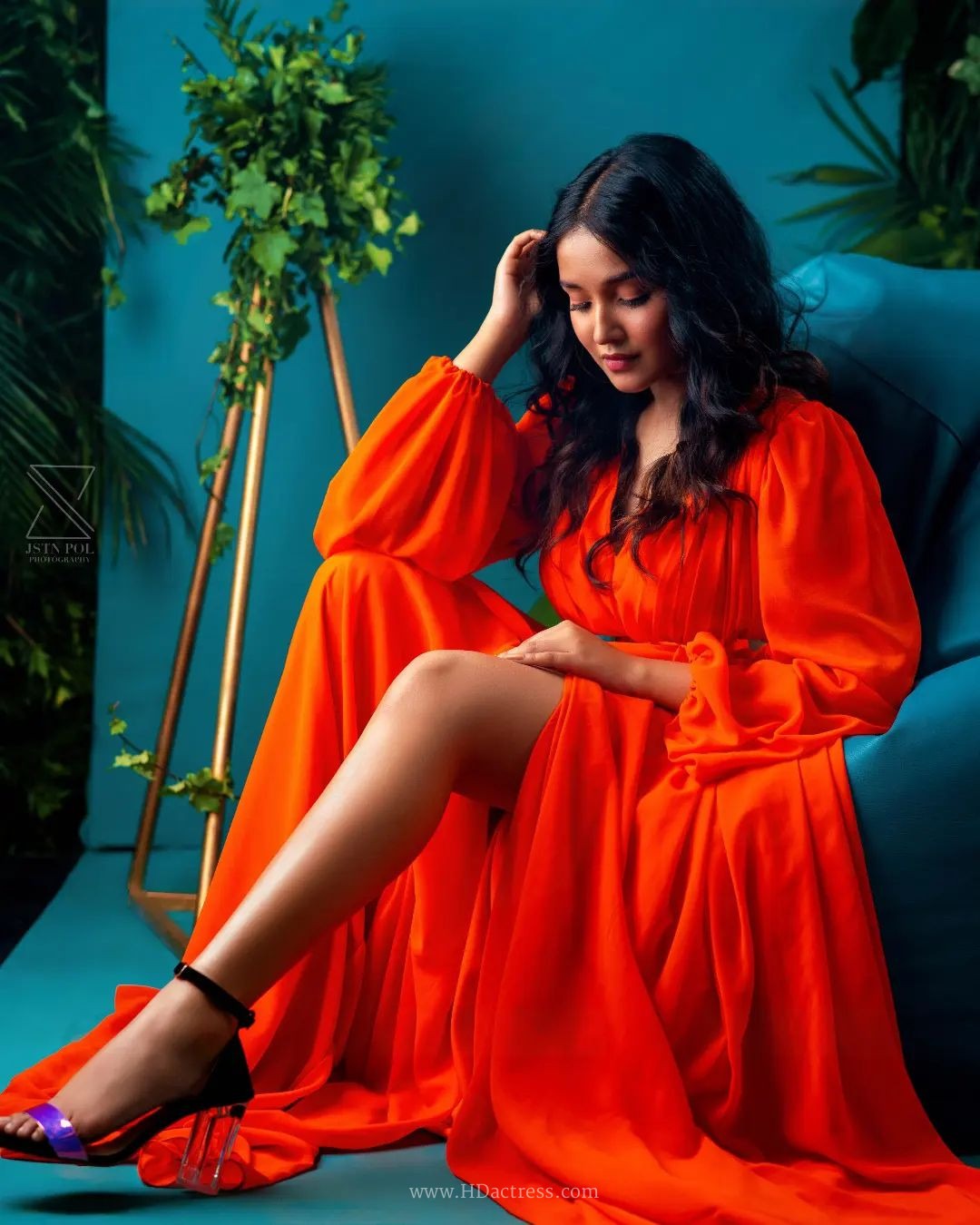 Anikha Surendran wearing vibrant orange maxi gown with billowy sleeves Anikha Surendran wearing vibrant orange maxi gown with billowy sleeves
