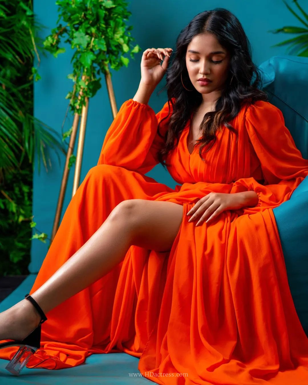 Anikha Surendran wearing vibrant orange maxi gown with billowy sleeves Anikha Surendran wearing vibrant orange maxi gown with billowy sleeves