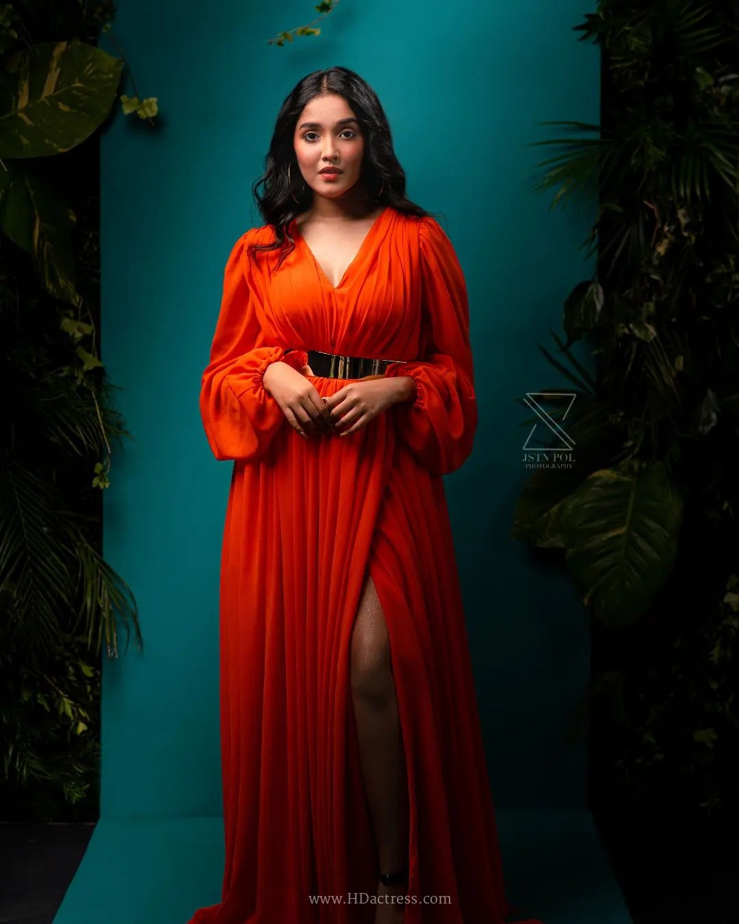 Anikha Surendran wearing vibrant orange maxi gown with billowy sleeves Anikha Surendran wearing vibrant orange maxi gown with billowy sleeves