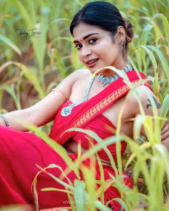 Dharsha Gupta wearing vibrant crimson red saree with matching blouse Dharsha Gupta wearing vibrant crimson red saree with matching blouse