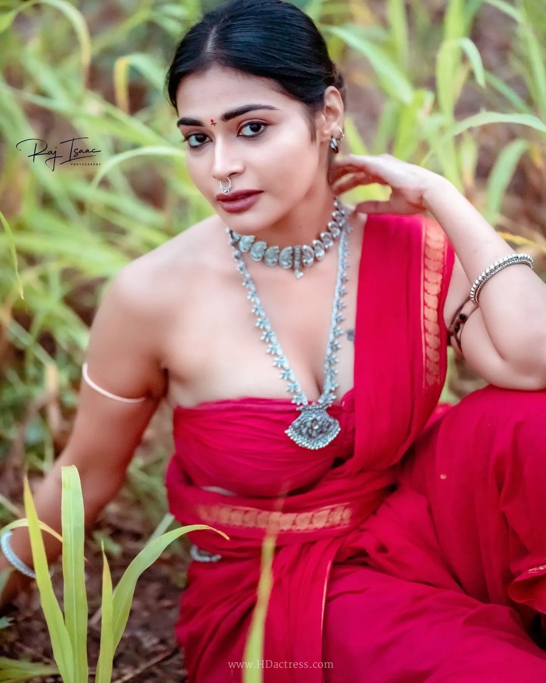 Dharsha Gupta wearing vibrant crimson red saree with matching blouse Dharsha Gupta wearing vibrant crimson red saree with matching blouse