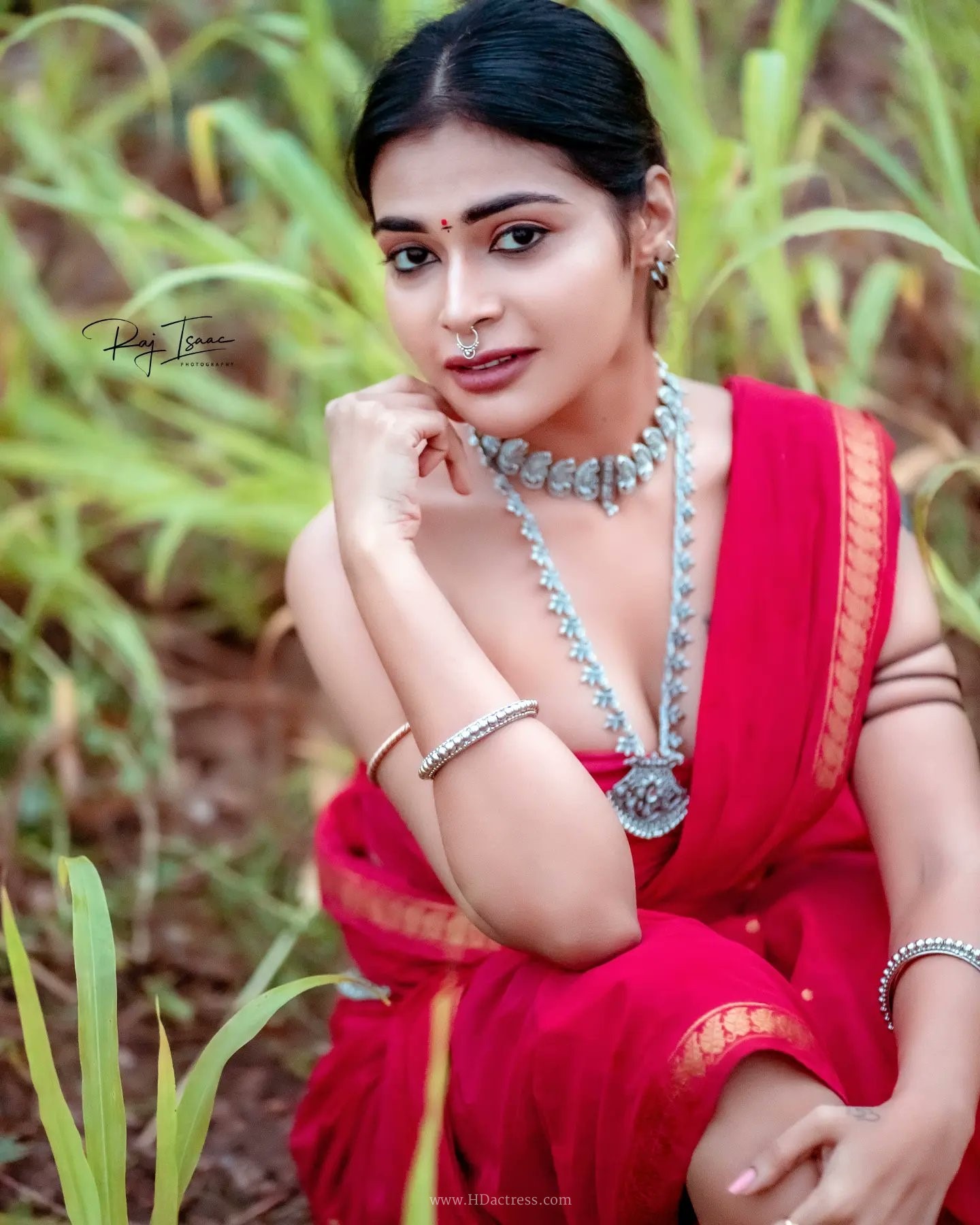 Dharsha Gupta wearing vibrant crimson red saree with matching blouse Dharsha Gupta wearing vibrant crimson red saree with matching blouse