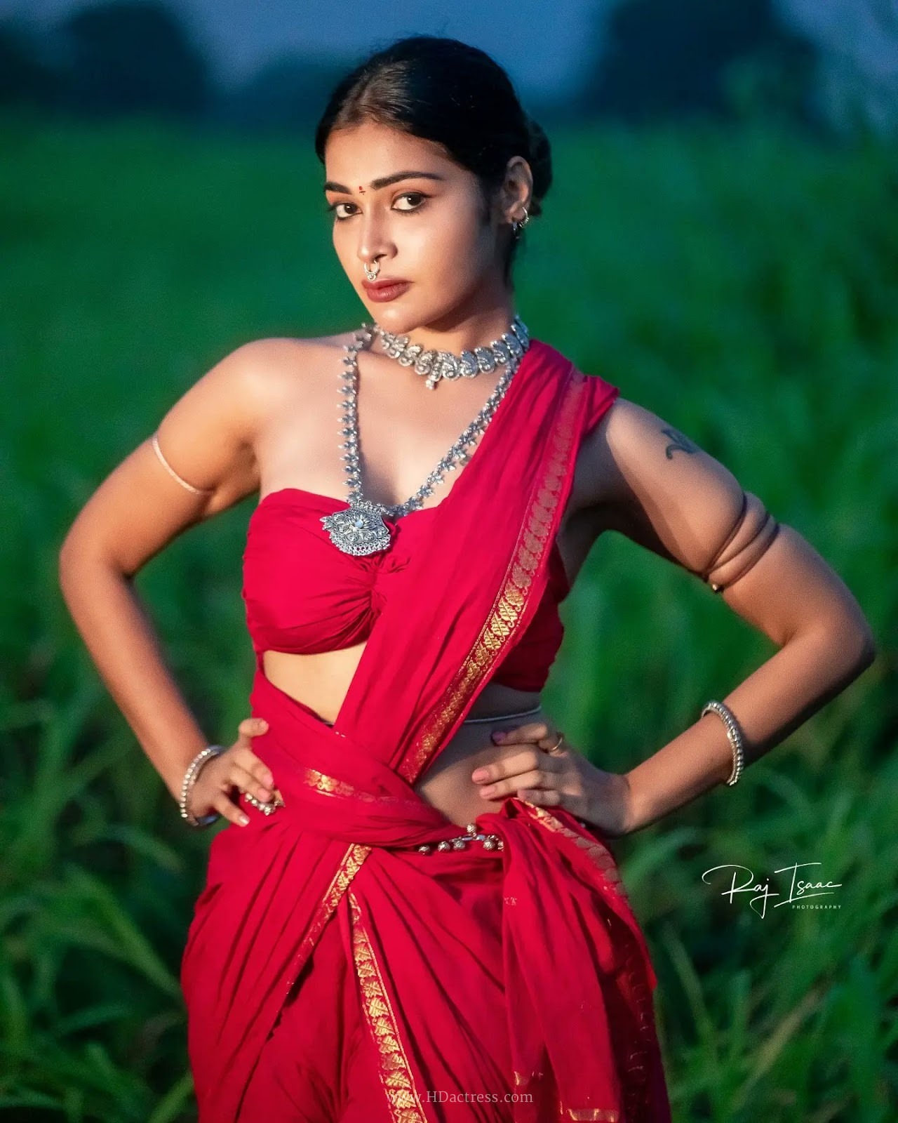 Dharsha Gupta wearing vibrant crimson red saree with matching blouse Dharsha Gupta wearing vibrant crimson red saree with matching blouse