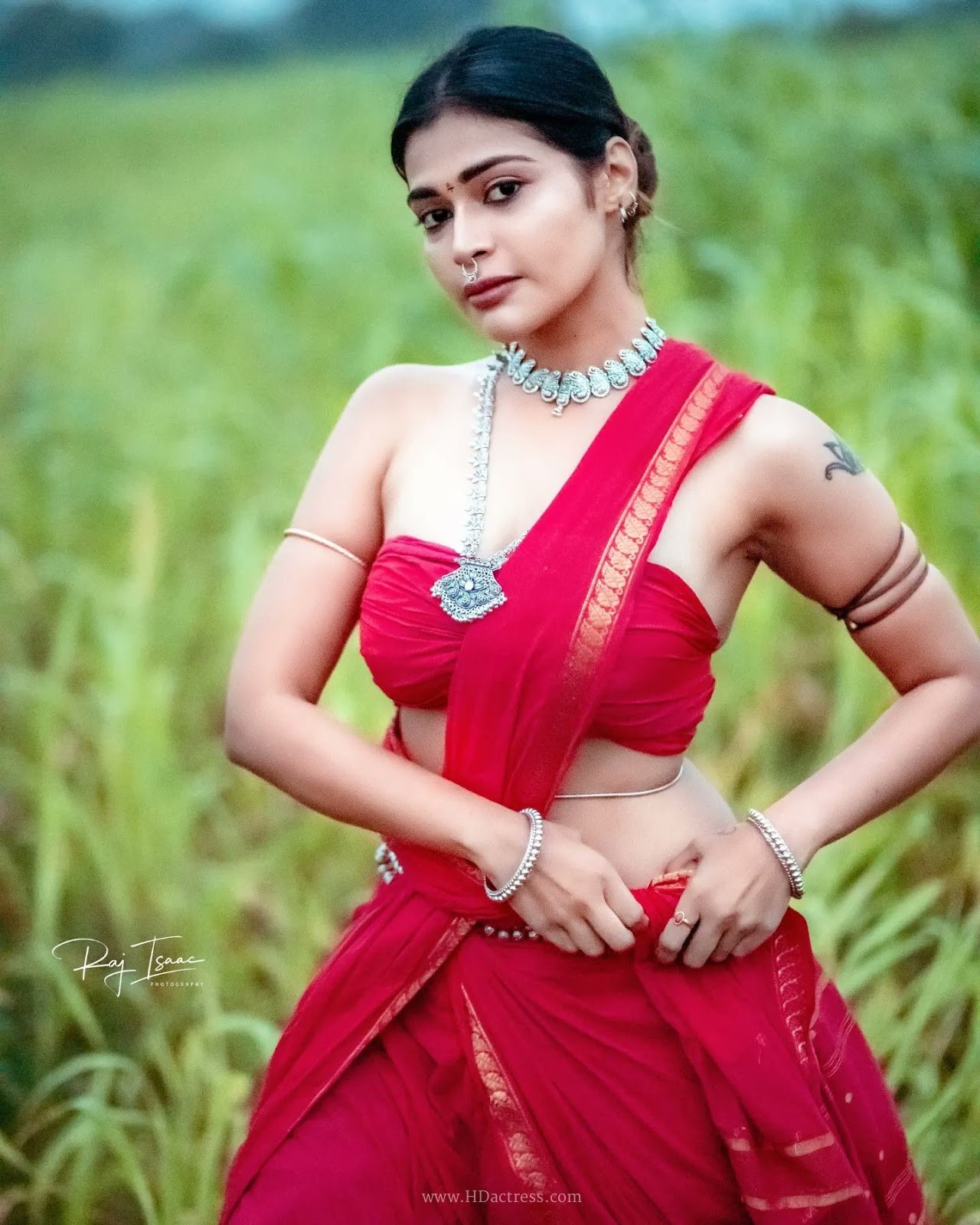 Dharsha Gupta wearing vibrant crimson red saree with matching blouse Dharsha Gupta wearing vibrant crimson red saree with matching blouse