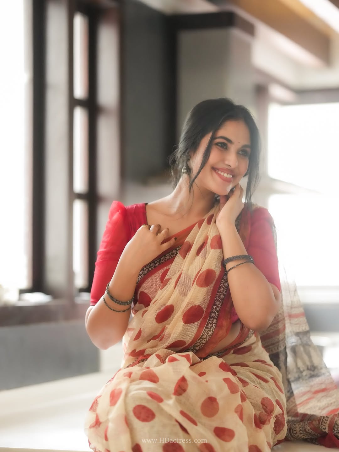 Gracy Thangavel in cream cotton saree with red polka dots
