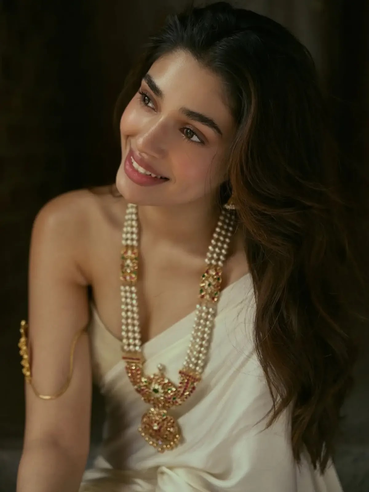 Krithi Shetty wearing an off-white silk saree with modern blouse