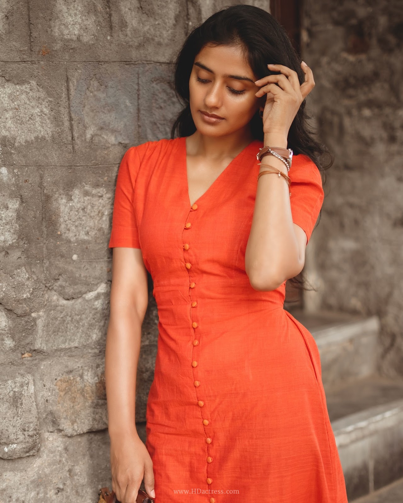 Sushmitha Bhat wearing a vibrant orange button-down maxi dress Sushmitha Bhat wearing a vibrant orange button-down maxi dress