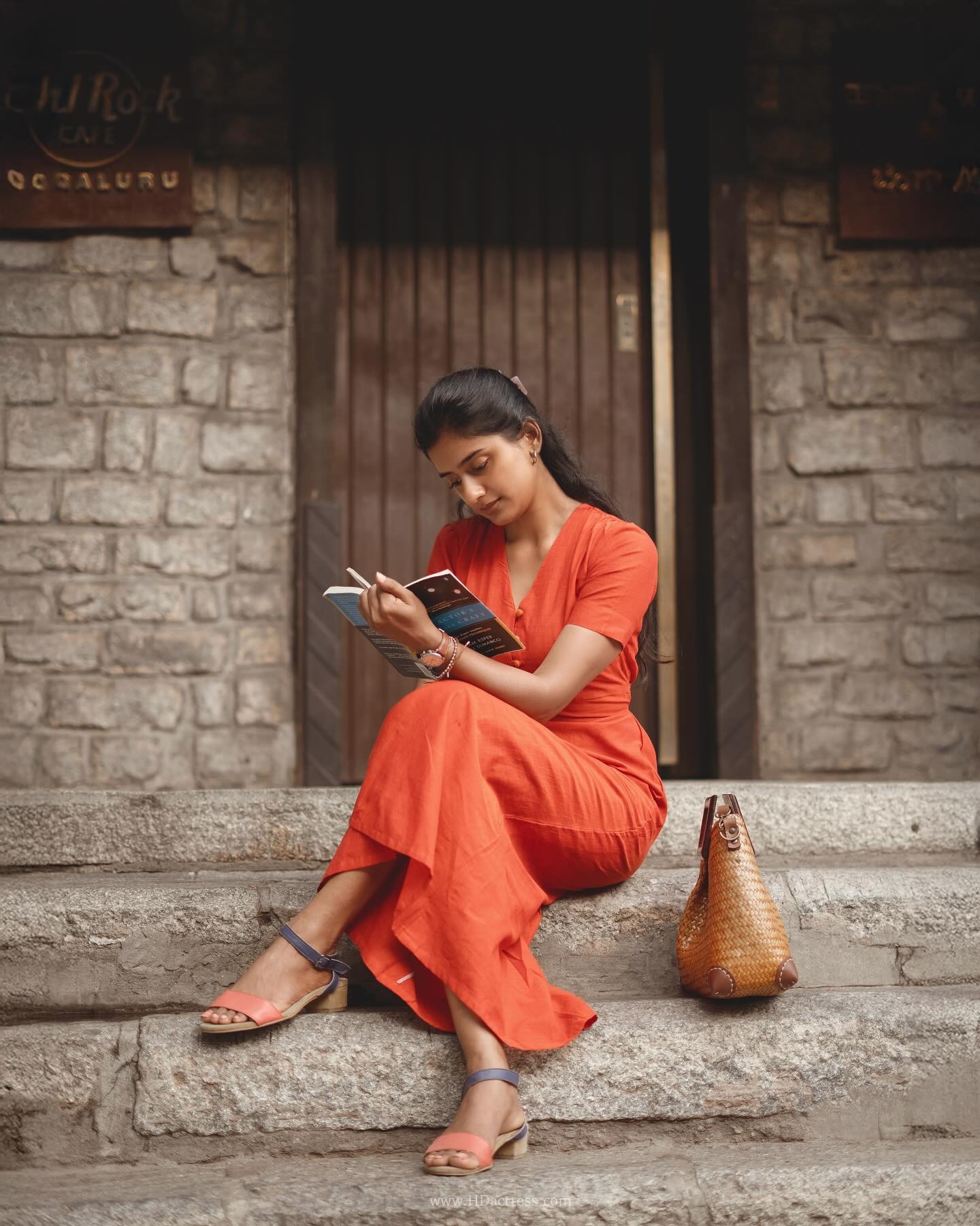 Sushmitha Bhat wearing a vibrant orange button-down maxi dress Sushmitha Bhat wearing a vibrant orange button-down maxi dress