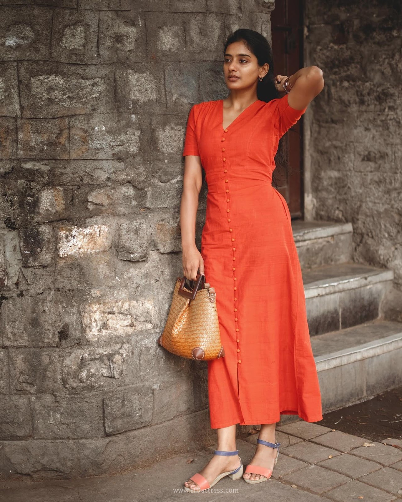 Sushmitha Bhat wearing a vibrant orange button-down maxi dress Sushmitha Bhat wearing a vibrant orange button-down maxi dress
