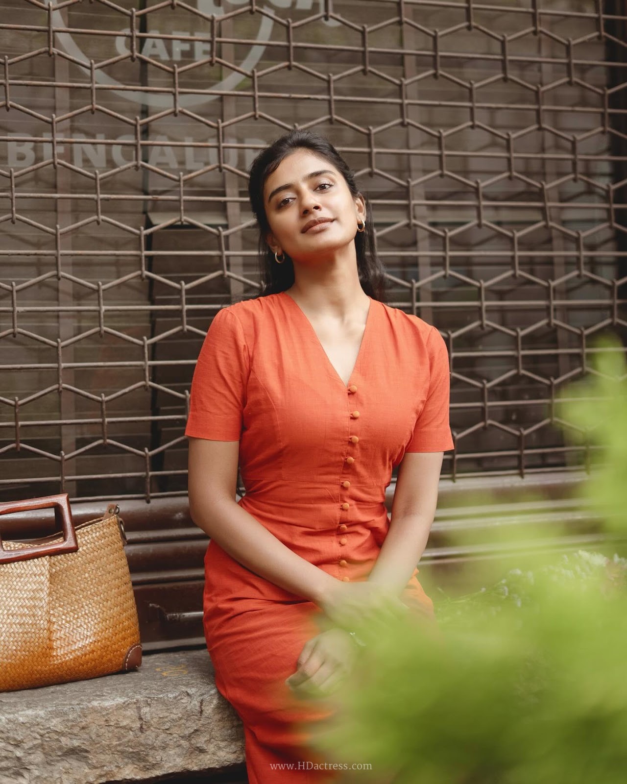 Sushmitha Bhat wearing a vibrant orange button-down maxi dress Sushmitha Bhat wearing a vibrant orange button-down maxi dress