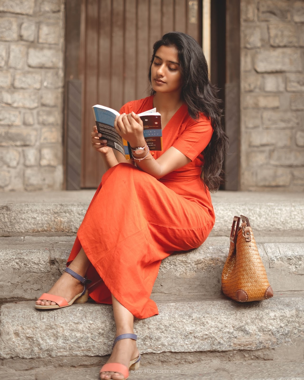 Sushmitha Bhat wearing a vibrant orange button-down maxi dress Sushmitha Bhat wearing a vibrant orange button-down maxi dress