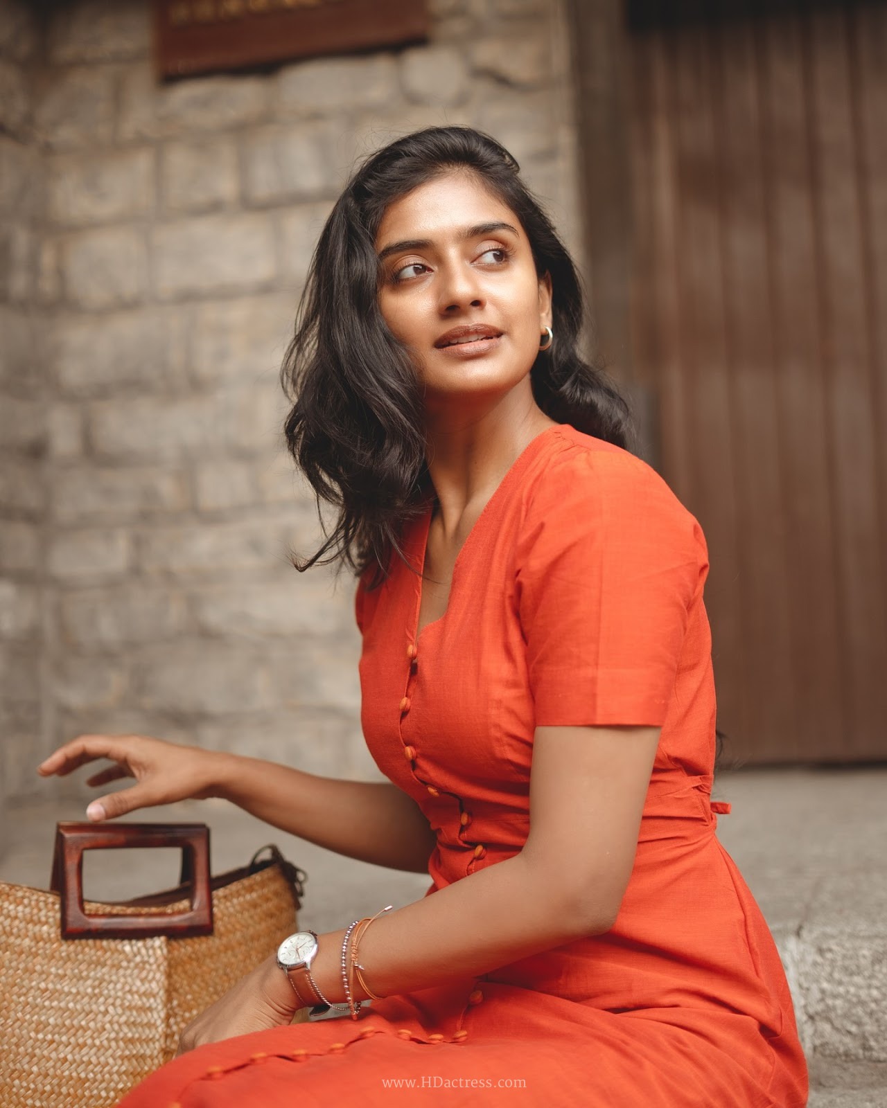 Sushmitha Bhat wearing a vibrant orange button-down maxi dress Sushmitha Bhat wearing a vibrant orange button-down maxi dress