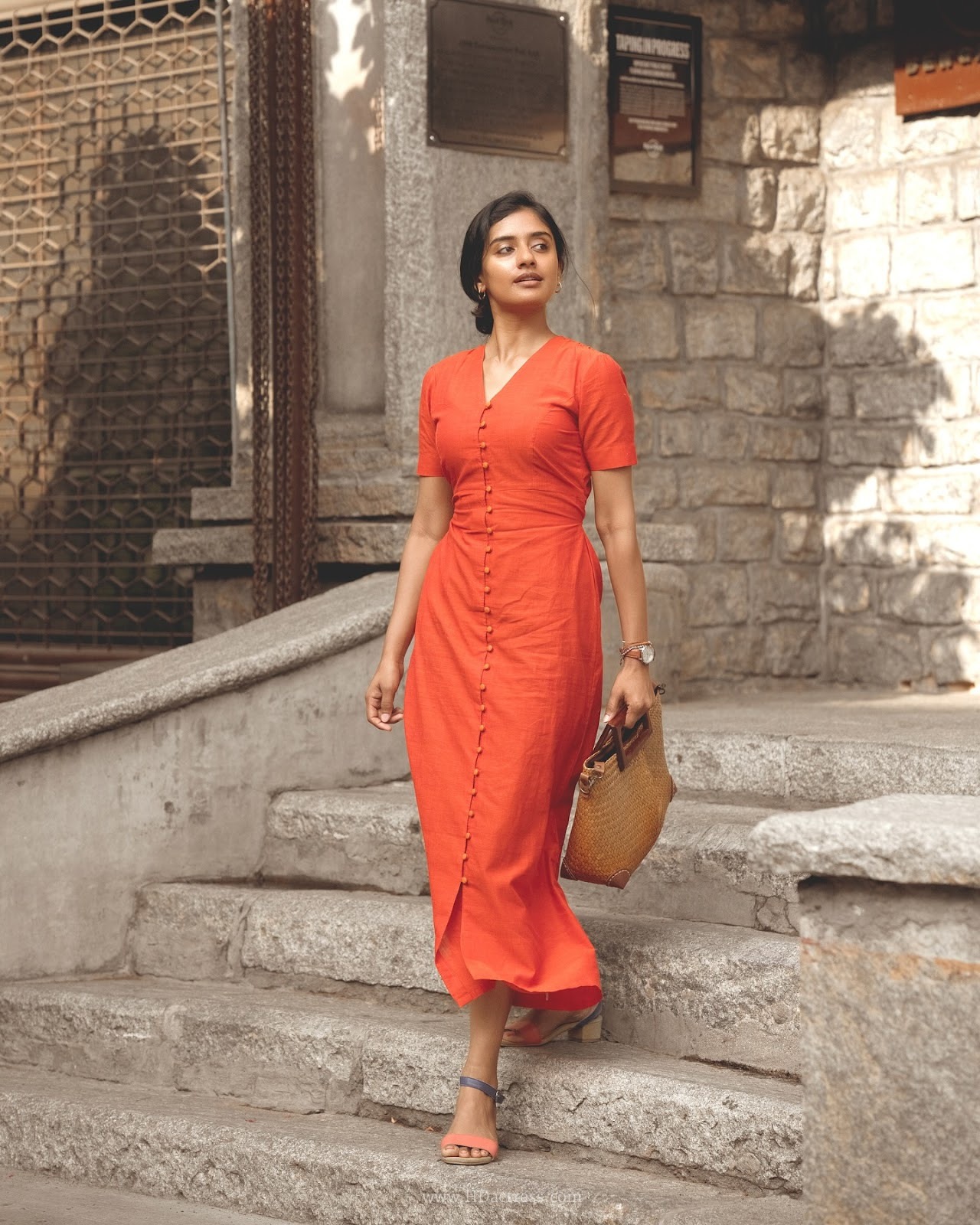 Sushmitha Bhat wearing a vibrant orange button-down maxi dress Sushmitha Bhat wearing a vibrant orange button-down maxi dress