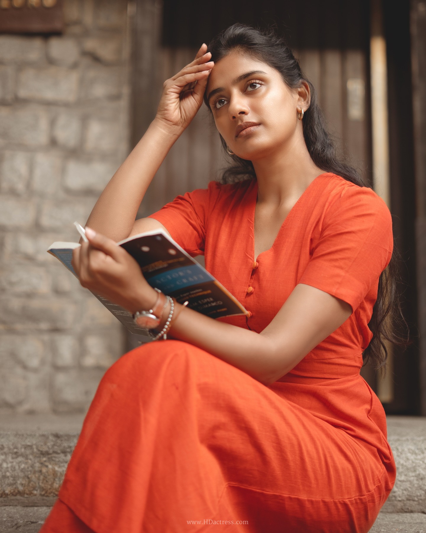 Sushmitha Bhat wearing a vibrant orange button-down maxi dress Sushmitha Bhat wearing a vibrant orange button-down maxi dress