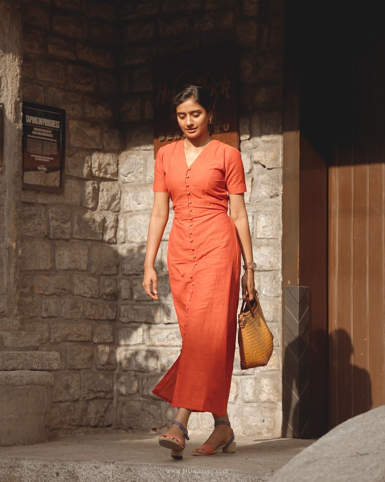 Sushmitha Bhat wearing a vibrant orange button-down maxi dress Sushmitha Bhat wearing a vibrant orange button-down maxi dress