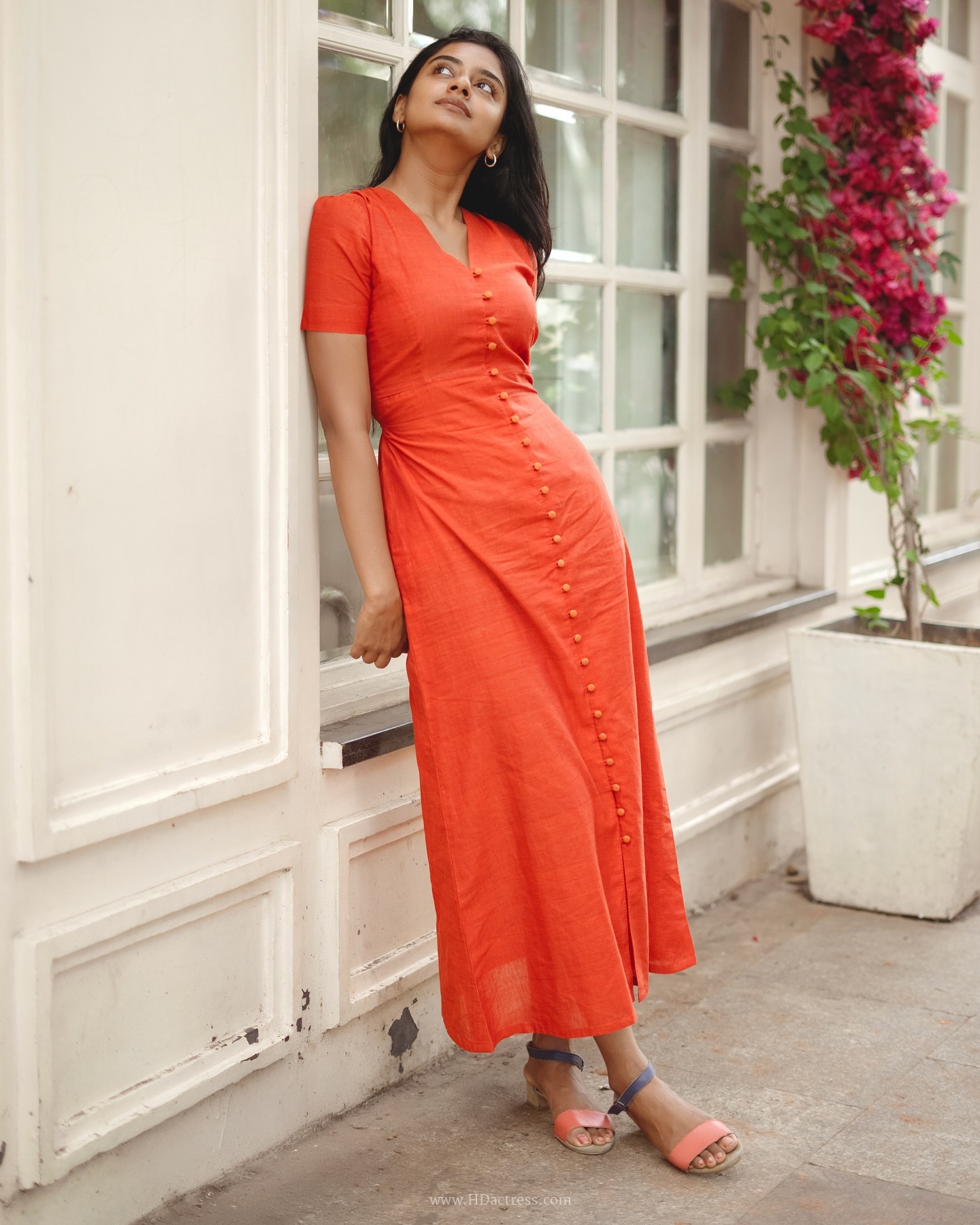 Sushmitha Bhat wearing a vibrant orange button-down maxi dress Sushmitha Bhat wearing a vibrant orange button-down maxi dress