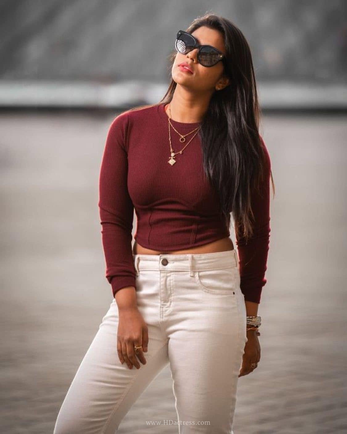 Aishwarya Rajesh wearing maroon crop top with white denim jeans Aishwarya Rajesh wearing maroon crop top with white denim jeans