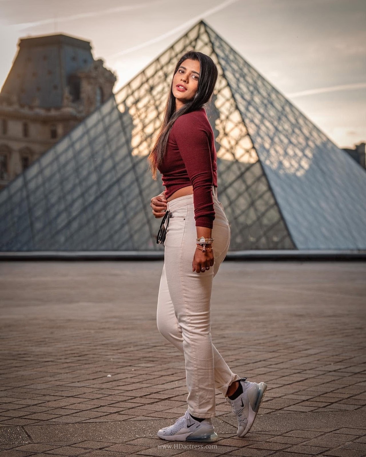 Aishwarya Rajesh wearing maroon crop top with white denim jeans Aishwarya Rajesh wearing maroon crop top with white denim jeans
