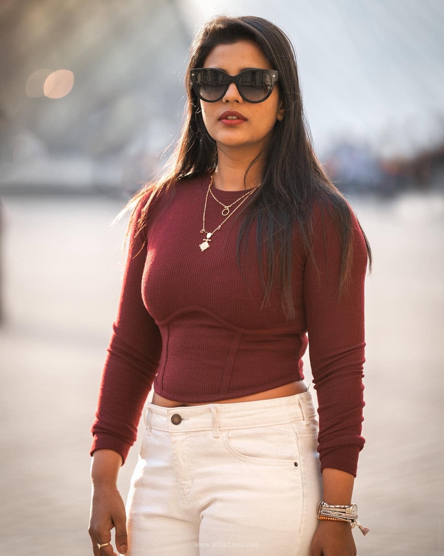 Aishwarya Rajesh wearing maroon crop top with white denim jeans Aishwarya Rajesh wearing maroon crop top with white denim jeans