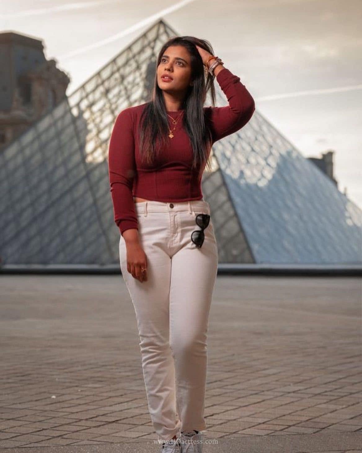 Aishwarya Rajesh wearing maroon crop top with white denim jeans Aishwarya Rajesh wearing maroon crop top with white denim jeans
