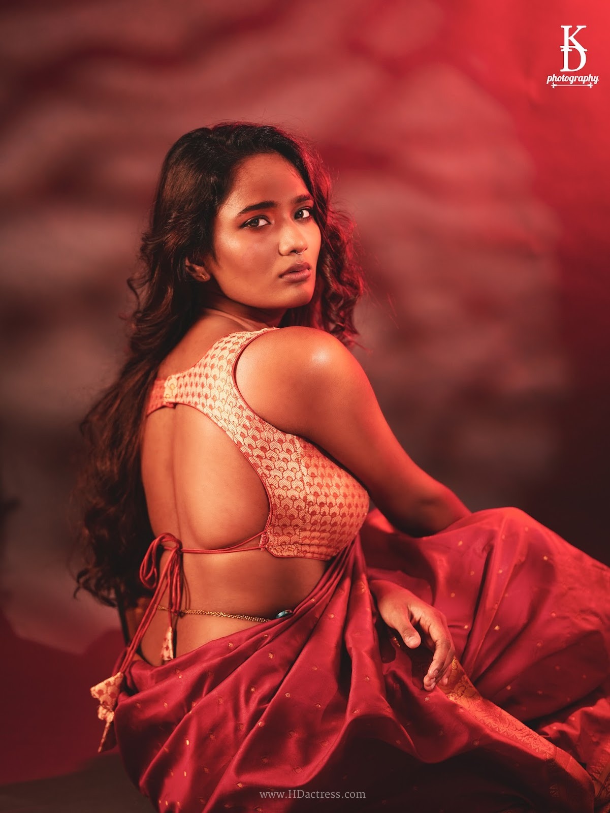 Alekhya Ramnaidu wearing maroon silk saree with gold zari border