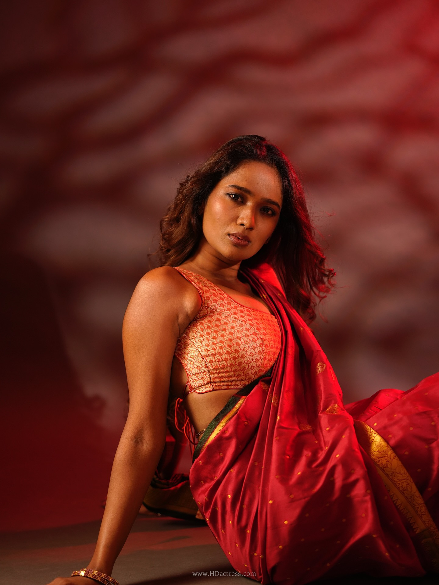 Alekhya Ramnaidu wearing maroon silk saree with gold zari border