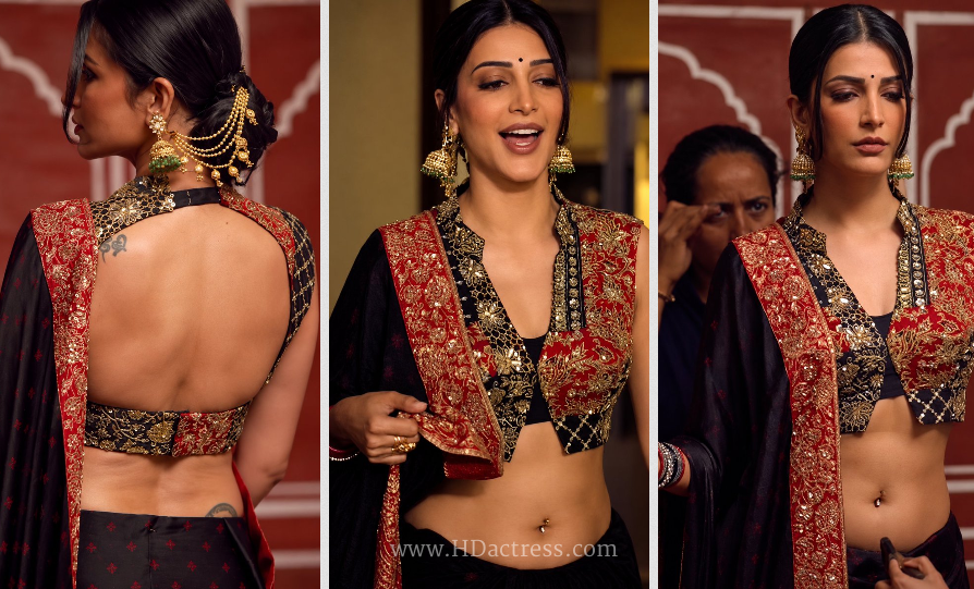 Shruti Haasan posing in elegant backless blouse revealing toned navel and piercing ring
