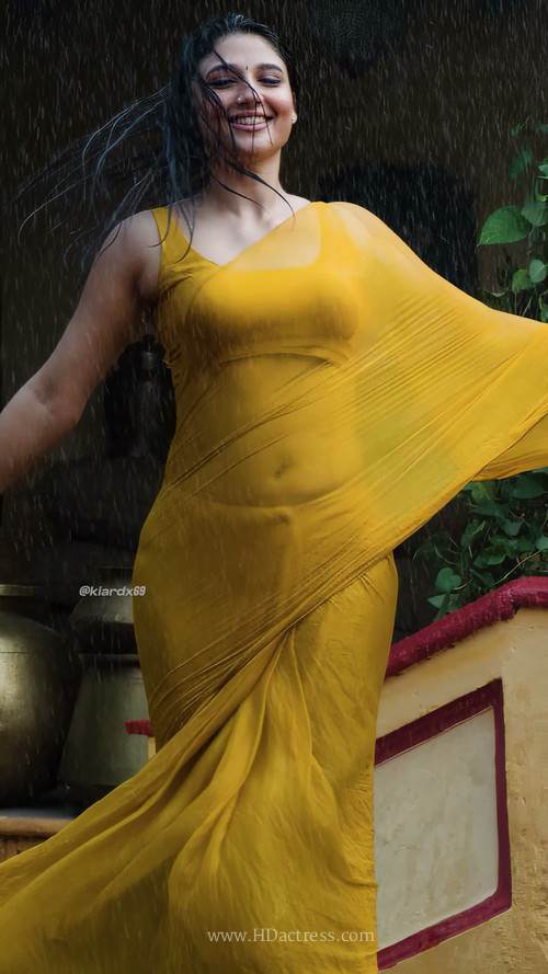 Ritika Nayak in wet red saree highlighting her deep navel and curves